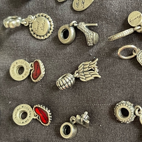 Lot of 26 Authentic Pandora charms.